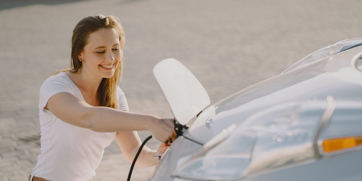 Car Subscription Services: The Future of Vehicle Ownership 7woman charging electro car electric gas station 2
