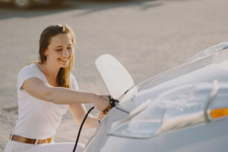 7woman charging electro car electric gas station 2