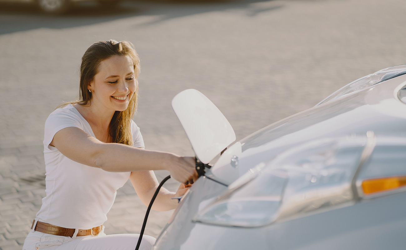 Car Subscription Services: The Future of Vehicle Ownership 7woman charging electro car electric gas station 2